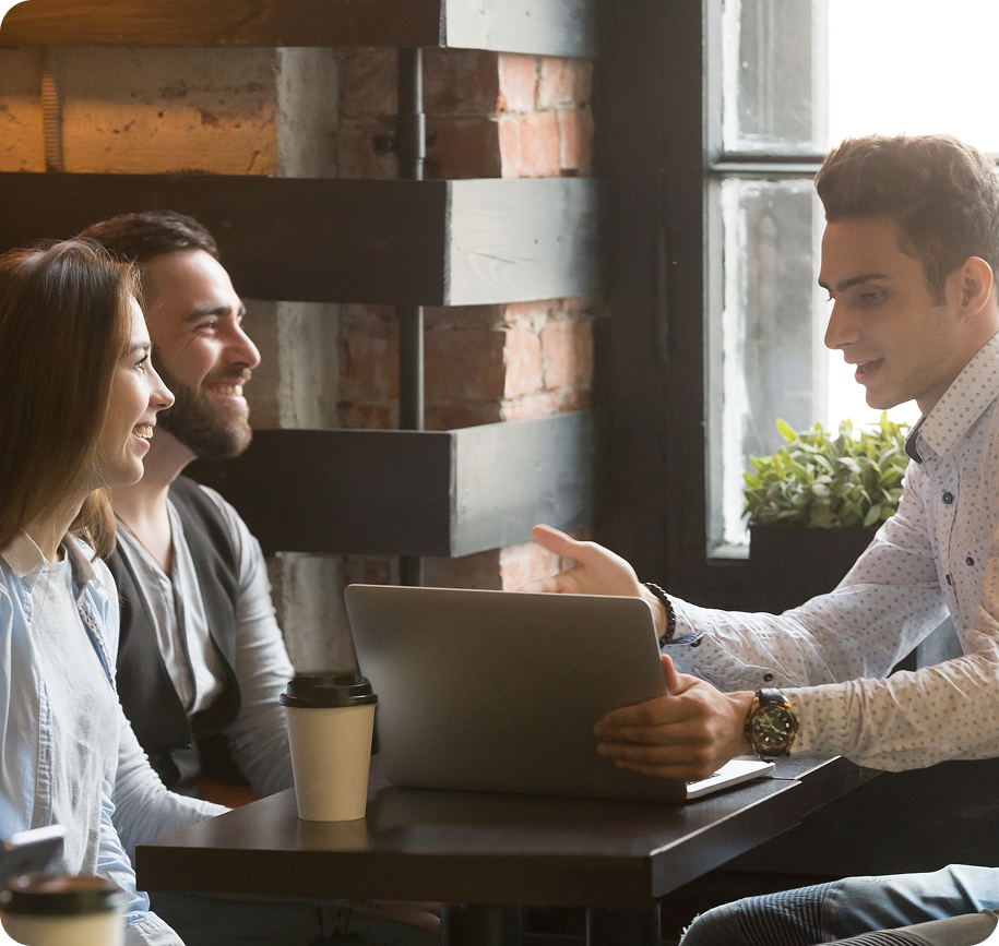 People having a meeting in a cafe.