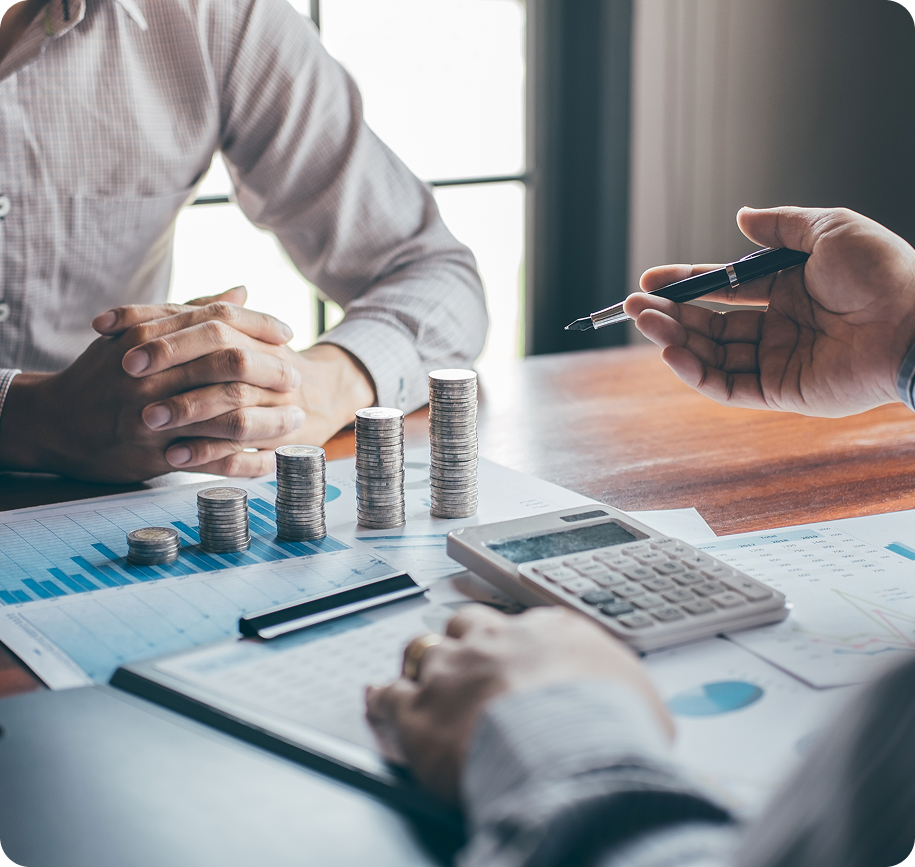 Business meeting with charts and coins.